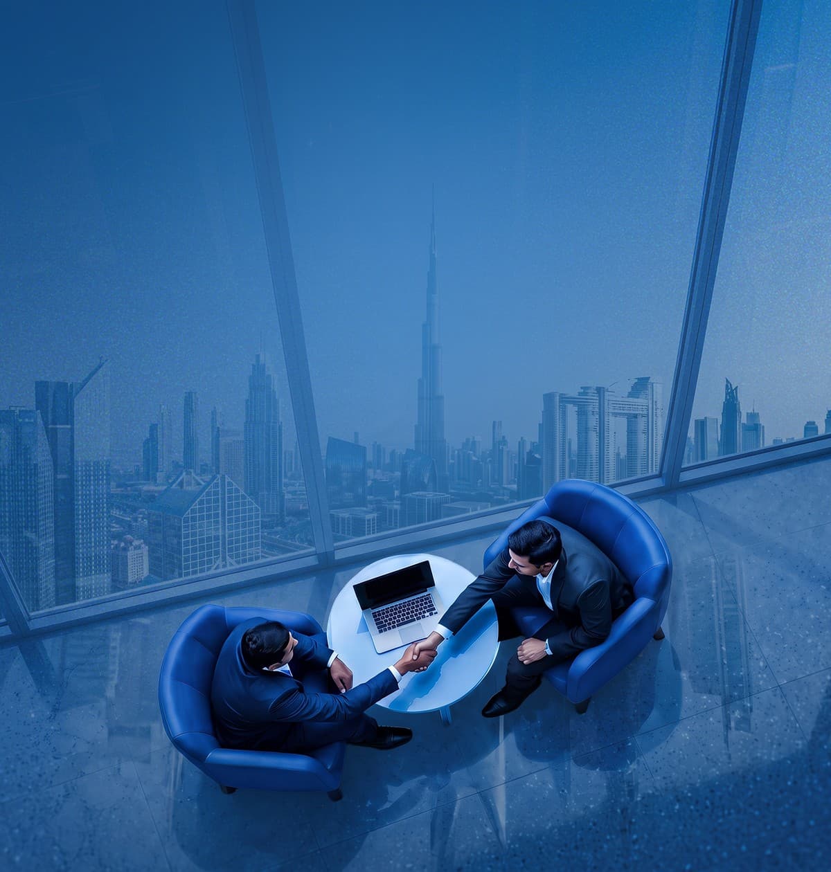 Two business partners shaking hands in a high-rise office